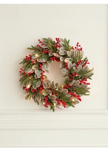Close-up of 40cm Christmas wreath with red berries, green leaves and glowing LED lights