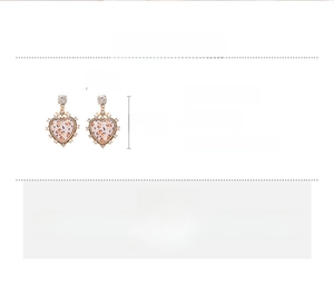 Detailed view of leopard print heart earrings with rhinestones and size specifications
