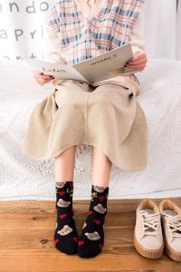 Detailed view of black cotton mid-calf socks with cute bear and heart patterns