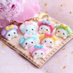 Macro view of My Melody resin donut charms for DIY phone cases in pastel macaron colors