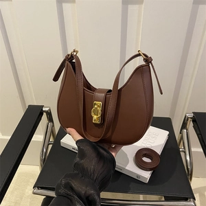 Brown faux leather crescent shoulder bag with gold metal buckle for women's daily commute