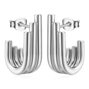 Macro detail of silver U-shaped tiered stainless steel earrings with polished metallic luster