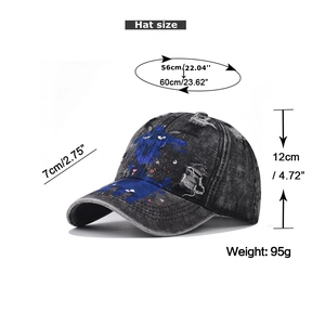 Detailed size chart of a black washed denim baseball cap with blue abstract animal graffiti