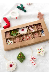 Detail of 12-grid gift box with handmade woolen felt Christmas tree and gingerbread ornaments