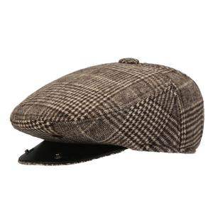 Retro brown plaid beret hat with black leather brim and metal rivets on white background