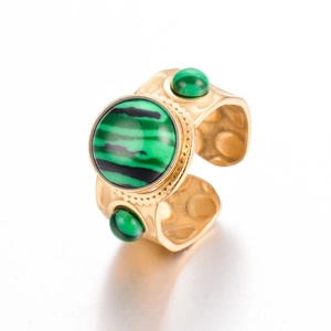Close-up of vintage gold ring with triple green malachite stones and hammered texture