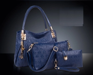 Three-piece sapphire blue handbag set with embossed pattern and gold butterfly charm