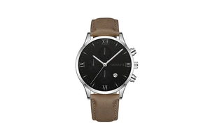 Detail view of the black dial featuring roman numerals and calendar window on leather watch