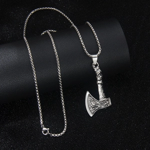 Nordic Viking rune axe pendant in silver stainless steel with box chain on dark stand