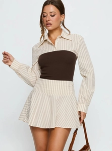 Detail of off-the-shoulder contrast stitching and pinstripe pattern on the dress set