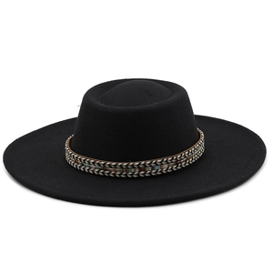 Detail of black wool fedora with ethnic style woven band on high-quality felt material