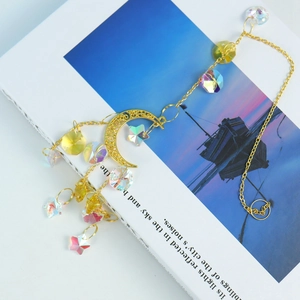 Detailed view of crescent moon suncatcher with crystal beads and gold stars
