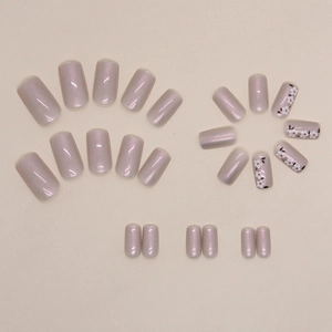 Aurora white floral press-on nails in medium square shape with pearlescent pink finish