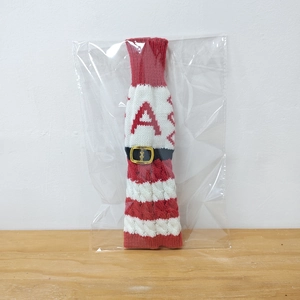 Christmas knitted wine bottle cover with red white stripes and belt buckle for holiday decor.