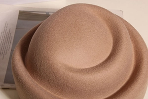 Detail of wool felt fabric and rolled brim texture on a vintage Audrey style hat