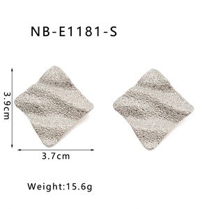 Macro view of silver wave textured square earrings with 3.9cm size and 15.6g weight details