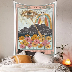 Detail of tarot tapestry on wall showing skull rower, rainbow and audacity text