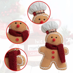 Close-up of Christmas gingerbread chef plush with focus on hat, scarf and stitching details