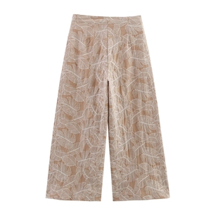 Women's high-waisted wide-leg trousers with white tropical monstera leaf print in khaki