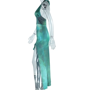 Detailed side view of green ink marble print dress with high side slit on model