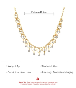 Detail of gold necklace showing alloy material specs, 7g weight and 47.5cm length measurements