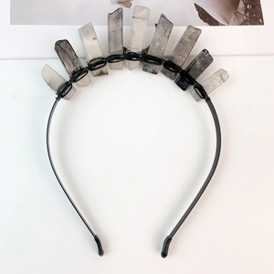 Detailed top view of natural crystal crown with hand-wired quartz on a black headband