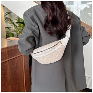 Close-up of beige woven texture and white leather strap detail on the stylish chest bag