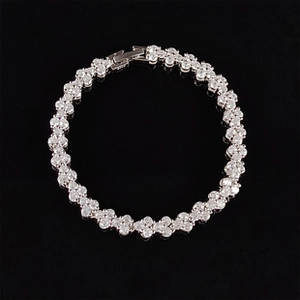 Detailed macro view of silver clover link bracelet featuring sparkling AAA cubic zirconia
