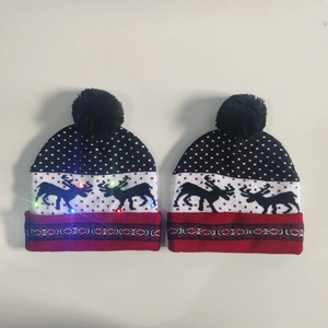 Navy blue Christmas knit hat with LED lights, reindeer jacquard pattern, and black pompom