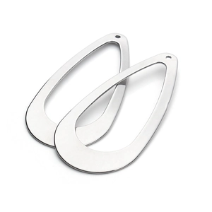 Macro view of teardrop stainless steel pendants with holes for DIY jewelry making