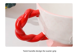 Close-up of a red woven texture handle on a ceramic mug for easy gripping