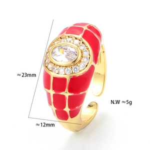 Detail showing gold enamel ring with red grid pattern, crystal center and dimensions