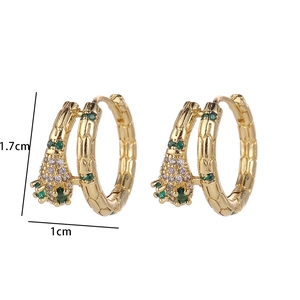 Detail of gold earrings with green and clear zircon showing 1.7cm and 1cm dimensions