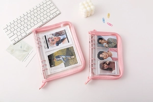 Pink zippered PVC binder album for photocards with transparent pockets and soft edges