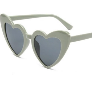 Fashionable heart shaped sunglasses with light green frames and dark grey lenses for UV protection