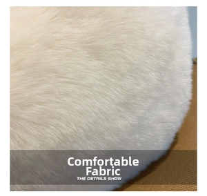 Close-up of soft fluffy faux fur fabric detail on white plush shoulder handbag