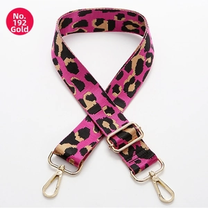 Close-up of leopard print canvas strap No. 192 with adjustable gold metal hardware