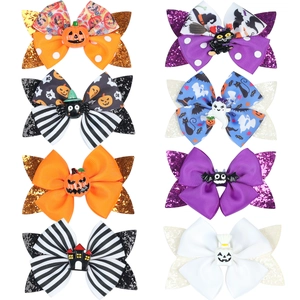 Detail of 8 Halloween hair bows featuring pumpkin, spider, and ghost motifs with glitter
