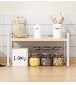 Single-tier kitchen counter rack with white metal frame and light wood shelf storage