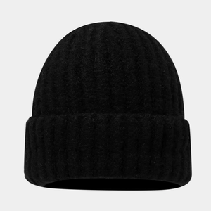 Detail of a thick rib-knit black beanie with a wide folded cuff for winter warmth