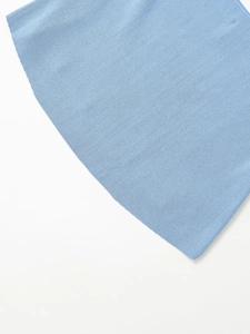 Detailed close-up of light blue ribbed knit texture on hooded denim jacket accessory