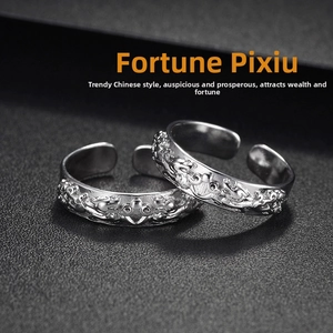 Macro detail of retro silver ring featuring intricate Chinese Pixiu relief engraving