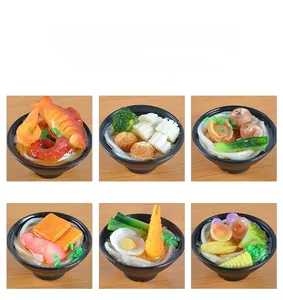 Detailed view of six different styles of artificial ramen bowl food model charms