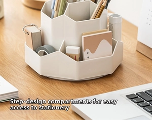 Close-up of a white rotating pencil holder with a 5-compartment tiered storage design