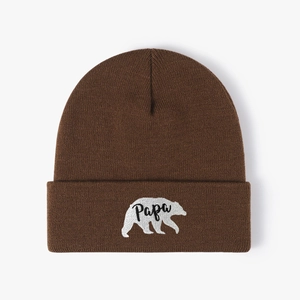 Dark brown knit beanie with white polar bear embroidery and Papa text on the cuff