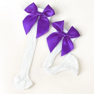 White mesh knee-high socks for girls featuring large purple satin bows in a minimalist style