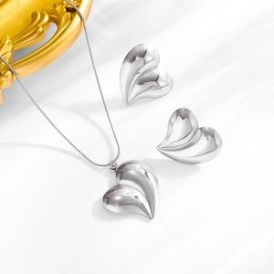 Polished silver heart pendant necklace and earring set in minimalist stainless steel