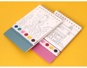 Detail of portable watercolor book with built-in paint palette and spiral binding