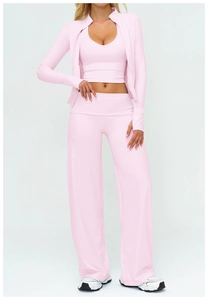 Detailed view of pink three-piece yoga set with zip-up jacket and wide-leg pants