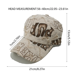 Close-up of distressed cotton baseball cap featuring vintage ripped edges and printed letters